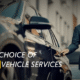 A professional chauffeur in a suit standing beside a luxury car, representing Aerial Cars private hire vehicle services in London.